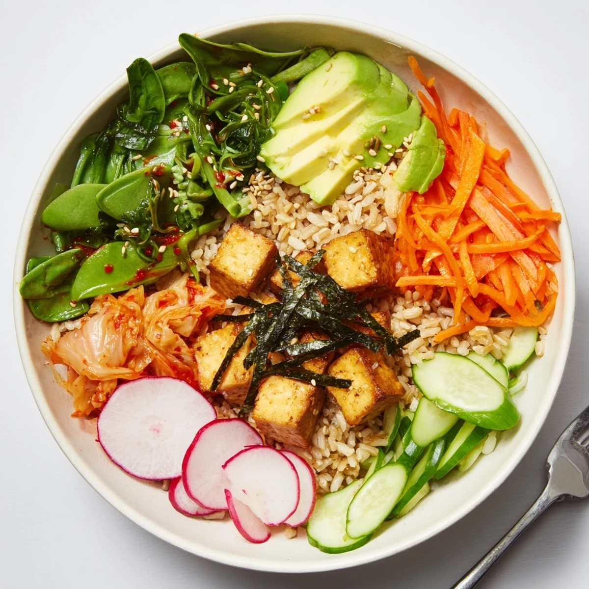 A colorful fermented vegetable bowl with tangy kimchi and fresh greens.  