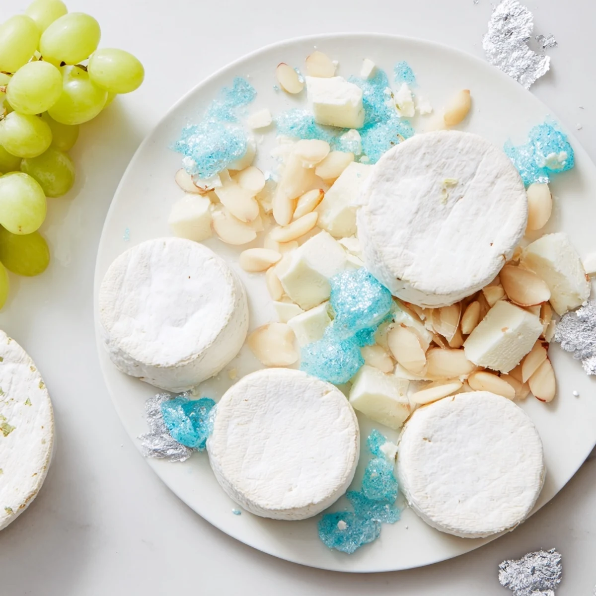 Elegant Winter Wonderland Platter: A snowy arrangement perfect for a holiday appetizer, featuring cheeses and crackers.