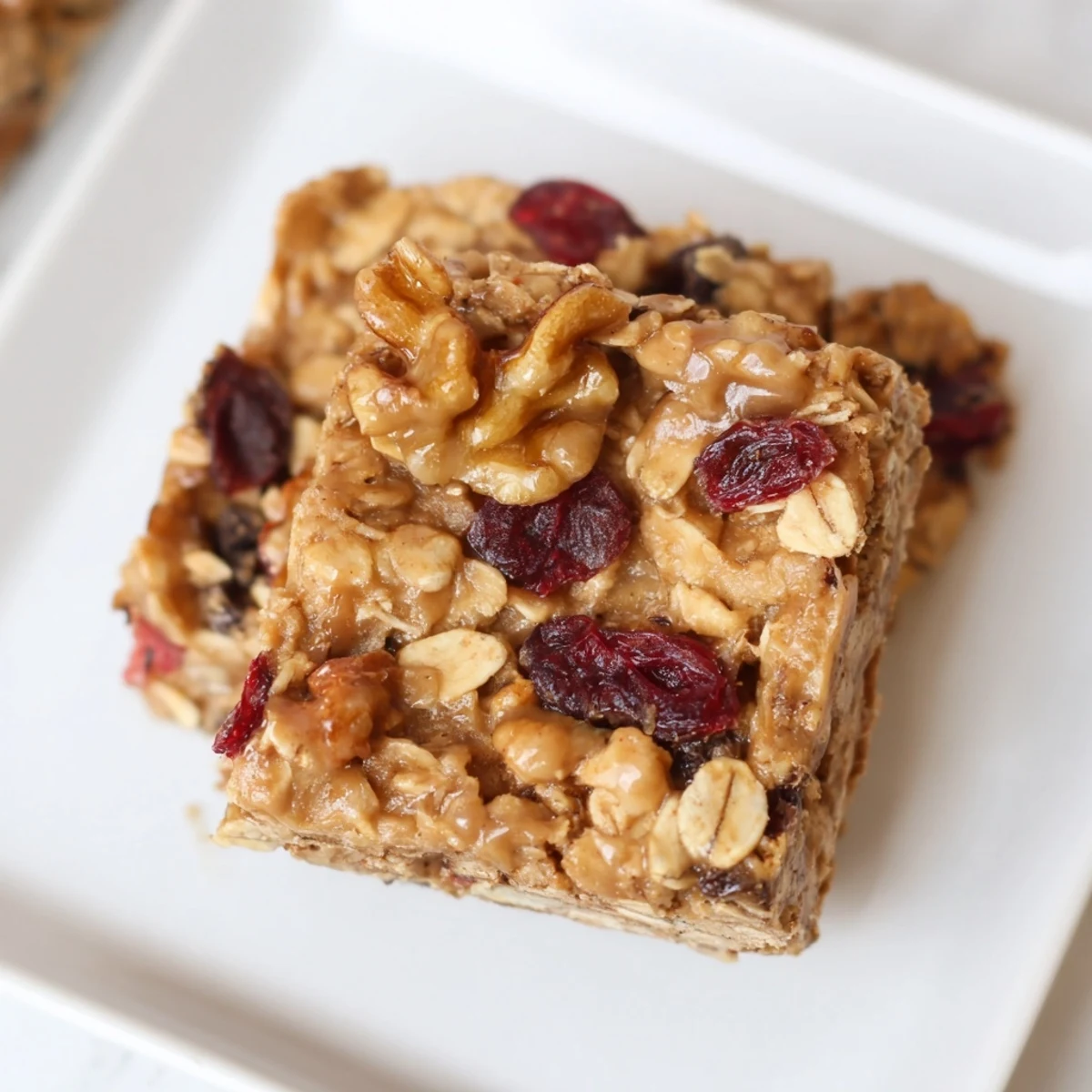 Sweet and wholesome: A close-up of freshly baked maple cinnamon oatmeal bars on a wooden surface.