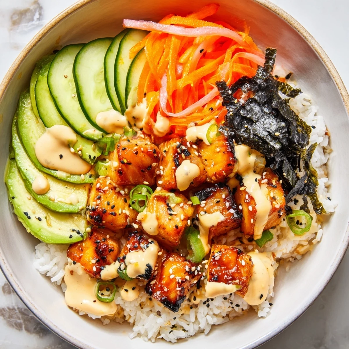 Enjoy this salmon bites bowl: juicy salmon pieces with spicy mayo, a flavorful, healthy meal.
