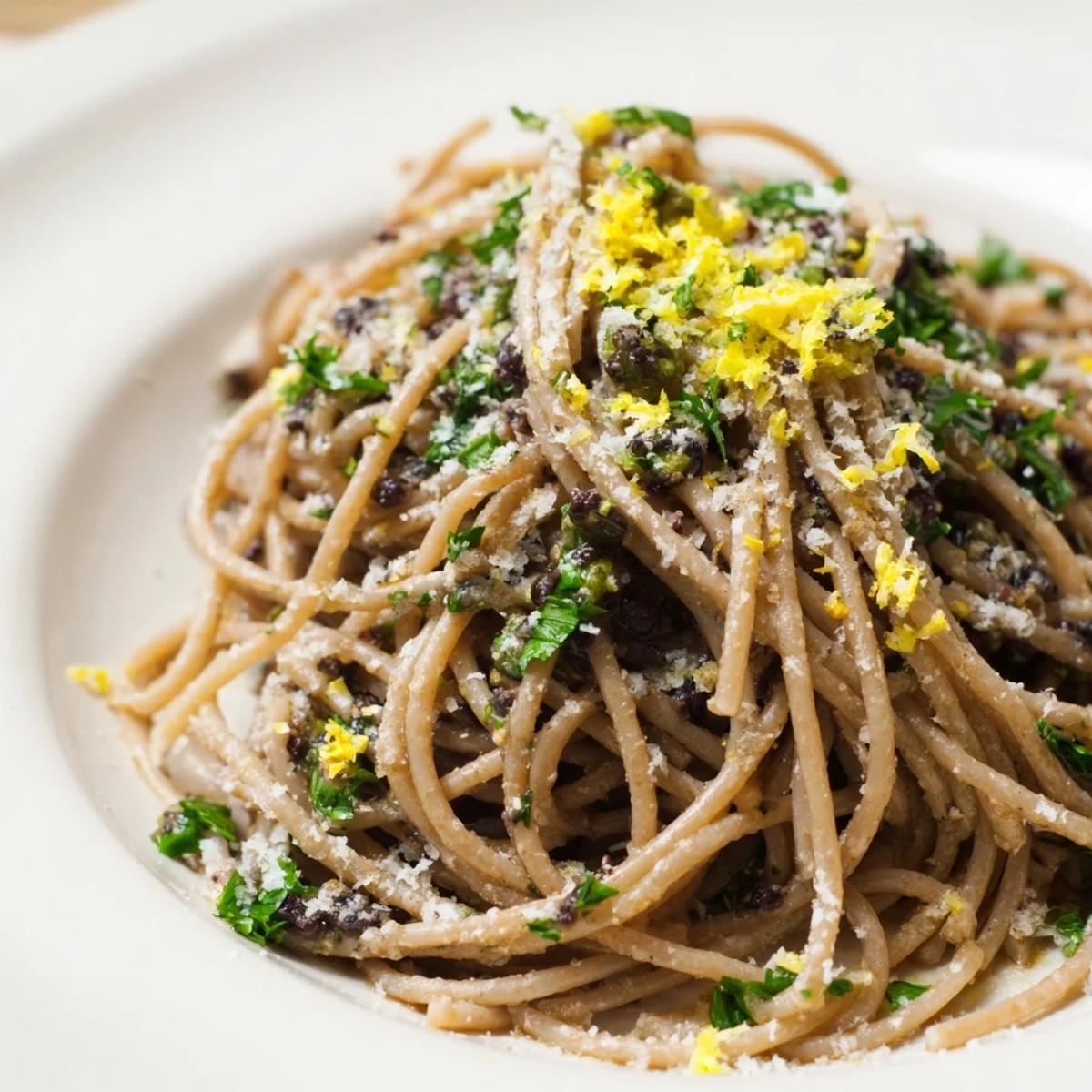 A bowl of Olive Tapenade Pasta, a delightful vegetarian Mediterranean main course.