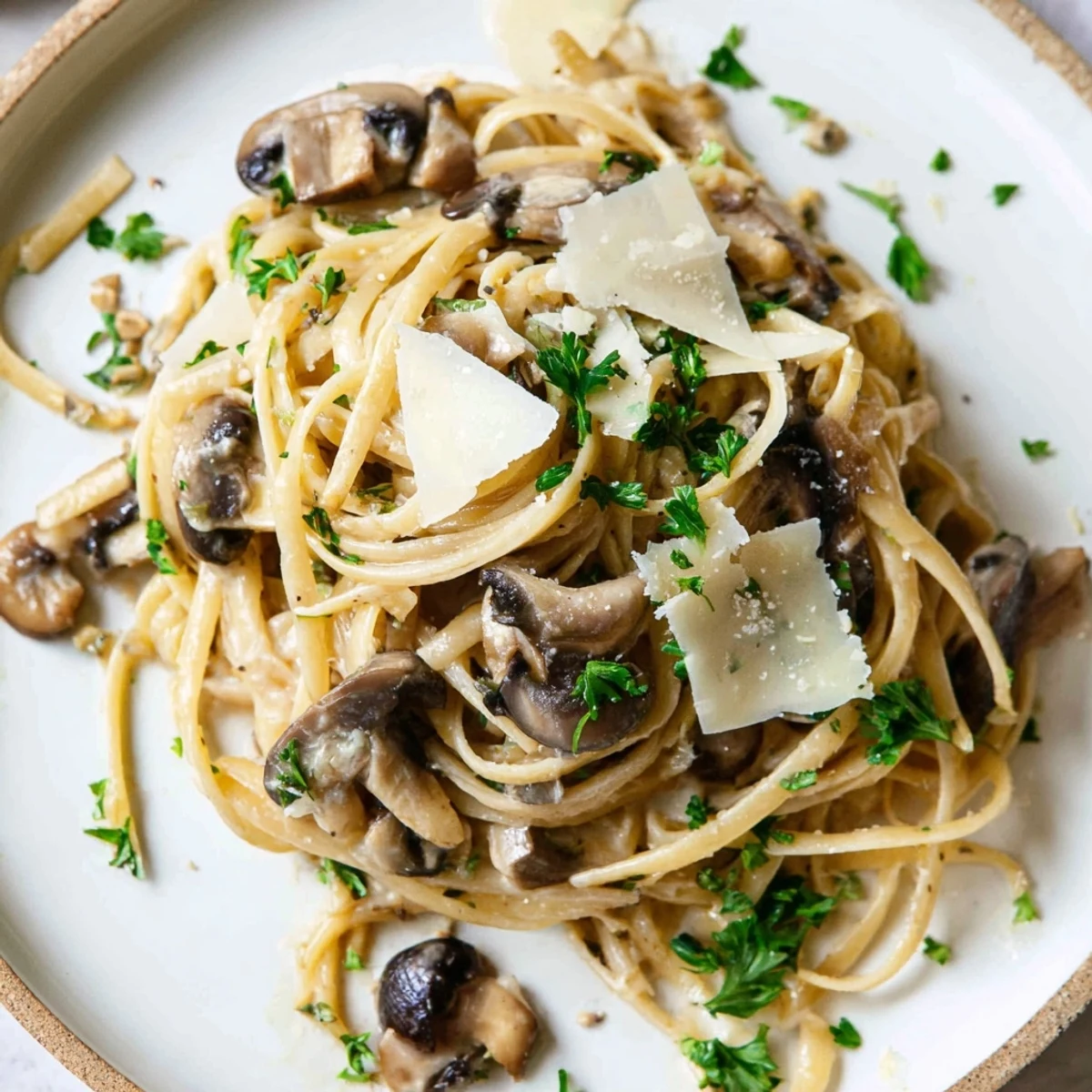A close-up of creamy mushroom linguine, a comforting Italian pasta dish ready to eat.