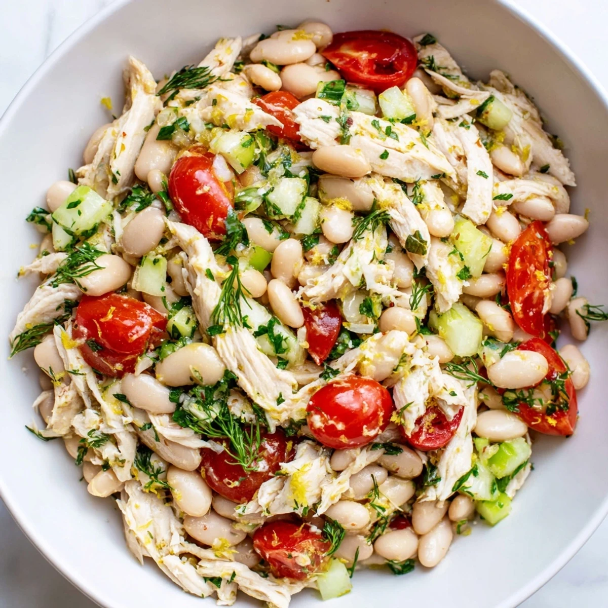 Tender shredded chicken and creamy white beans tossed with crisp celery and fresh herbs in a bright lemon vinaigrette.