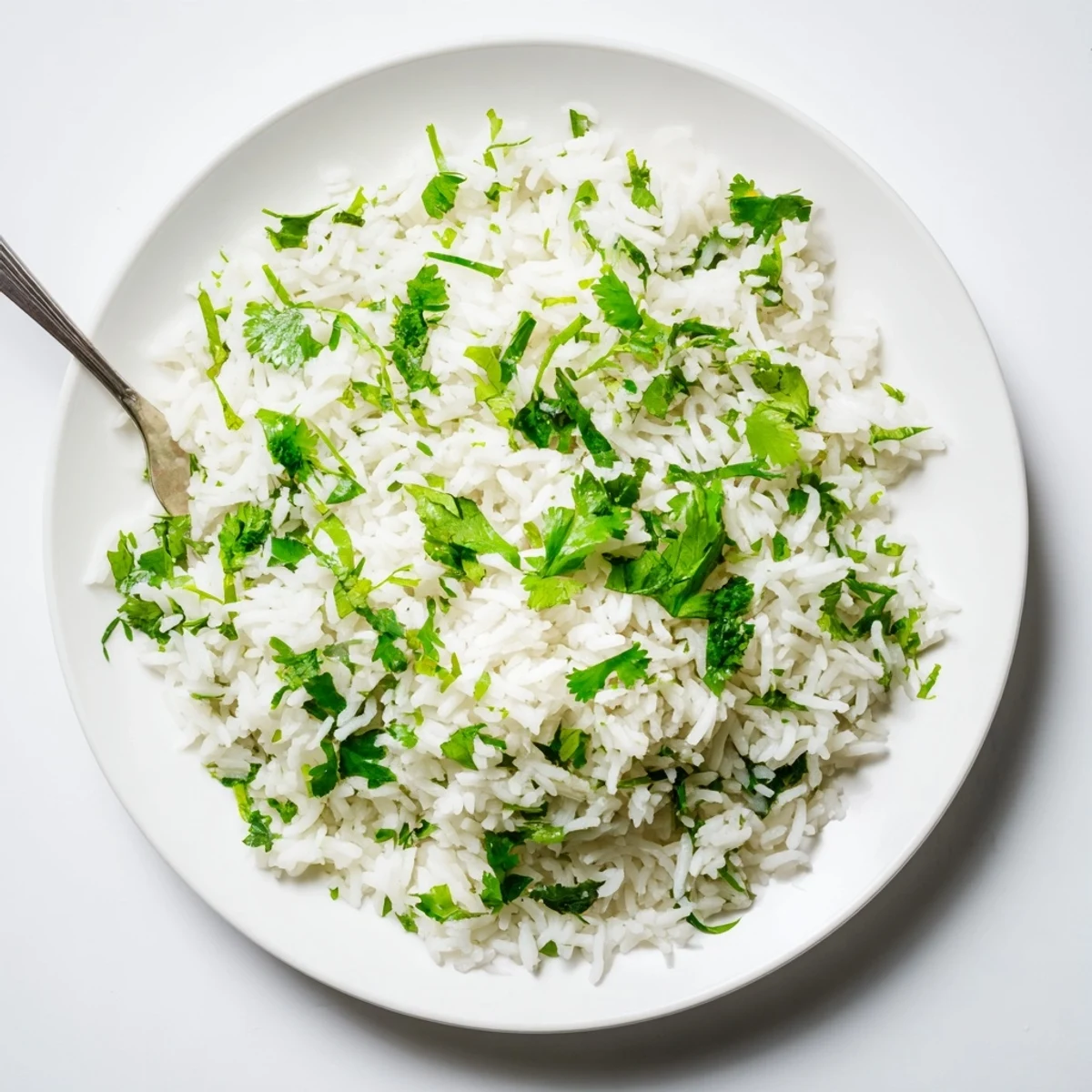 A steaming pot of cilantro lime rice with fresh herbs and citrus, ready to accompany tacos or grilled meats.