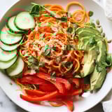 Freshly prepared Carrot Noodle Skincare Bowl showing spiralized carrots as noodles, ready to eat.
