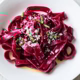 Close-up of freshly cooked Beet Noodle Pasta, showing its beautiful color and delicate texture.