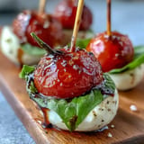 Vibrant mini skewers showcasing cherry tomatoes, mozzarella, basil, ready to enjoy.