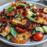 Juicy heirloom tomatoes and charred bread star in this Summer Panzanella masterpiece.