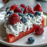 Juicy watermelon pizza with fresh berries, a delicious summer dessert treat.