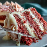 A stunning Bridal Shower Rosé Velvet Cake, frosted generously, ready for celebration.