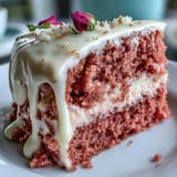 A moist pink velvet cake perfect for celebrations, adorned with edible gold.