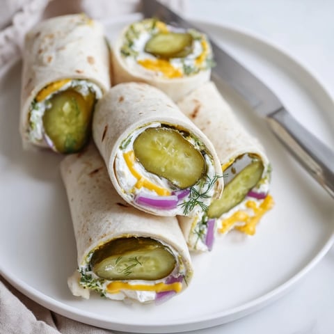 Crispy Pickle-in-a-Blanket with creamy cheese, perfect for parties and snacks.  