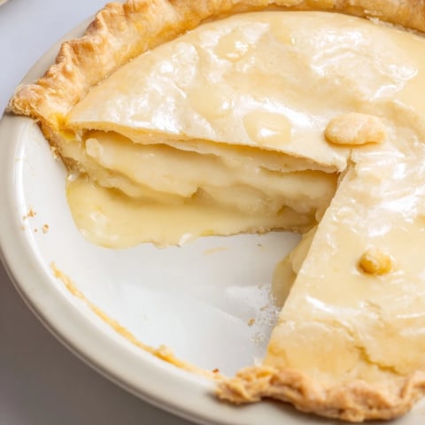Golden, baked Water Pie, a simple, old-fashioned dessert with a creamy, jiggly custard filling.