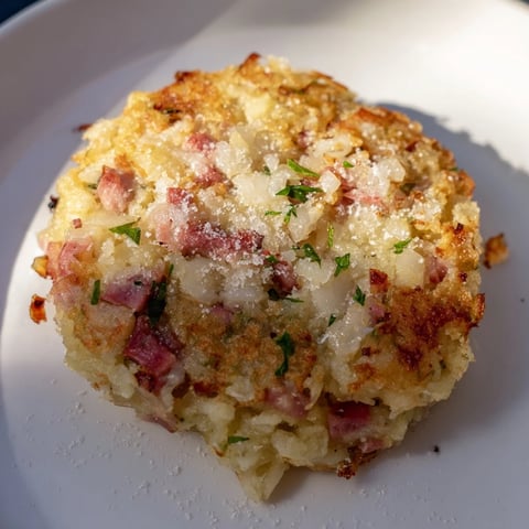 Golden, crispy Depression-Era Ham & Potato Patties ready to eat, served with a side of ketchup.