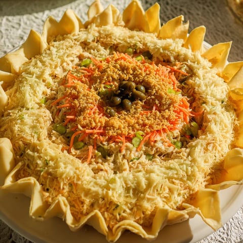 Golden-brown Chicken Piccata Mini Hand Pies, brimming with savory chicken and zesty lemon flavor.