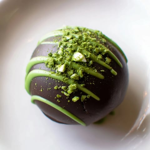 Mouthwatering Matcha Dark Chocolate Peppermint Truffles, rolled in green matcha and ready to enjoy.