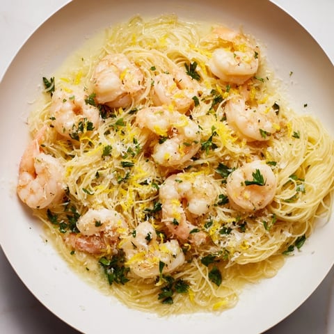 One-Skillet Lemon Garlic Shrimp Angel Hair Pasta with perfectly cooked pink shrimp and bright lemon zest.