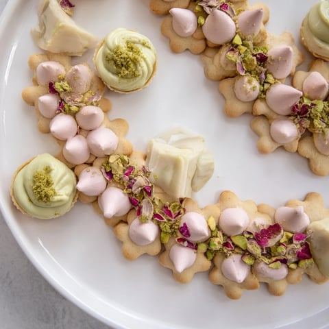 Daisy Chain Dessert Tray, a beautiful arrangement of mini desserts, perfect for a celebration party.
