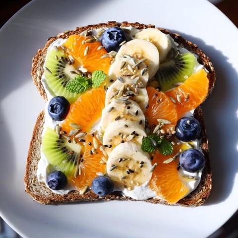 Morning Sun Breakfast Toast Designs with vibrant fruit and creamy textures, a perfect breakfast.