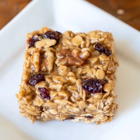 Golden-brown maple cinnamon oatmeal bars, sliced and ready to enjoy as a breakfast treat.