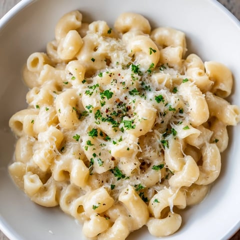 Creamy ditalini pasta glistening, with fresh parsley garnish, ready for a satisfying Italian-American dinner.