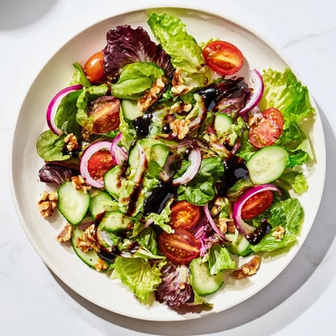 Vivid Quick Balsamic Vinegar Salad; fresh salad greens glistening with a tangy balsamic dressing.