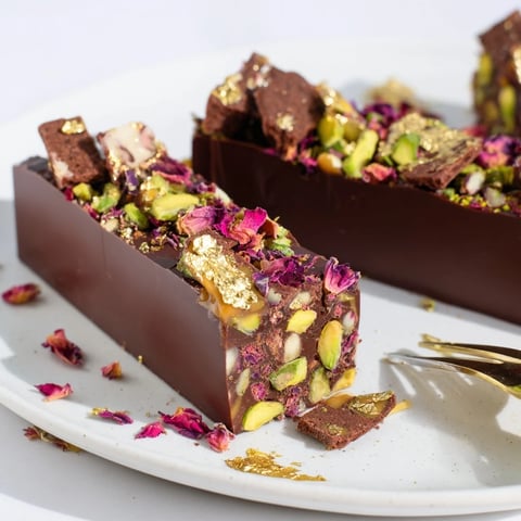 Decadent chocolate bar inspired creations with pistachios and rose petals garnishing.  