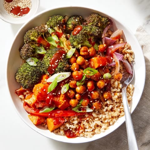 Colorful grain bowls featuring gochujang-maple sauce, roasted sweet potatoes, and crispy chickpeas.  