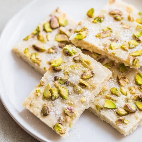 Freshly baked Salted Pistachio Slice & Bake Shortbread, showcasing a delightful buttery flavor and texture.