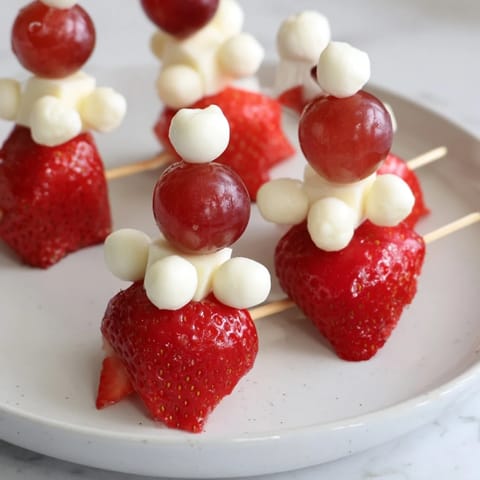 Festive Santa Hat Fruit and Cheese Platter, a visually appealing appetizer for holiday parties and get-togethers.