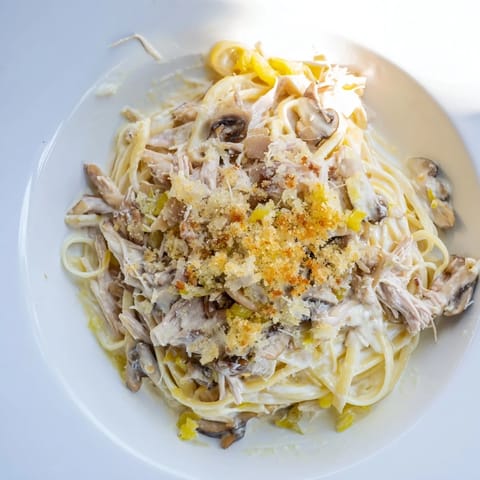 This delicious Turkey Tetrazzini features tender turkey pieces with a bubbly, cheesy golden top.