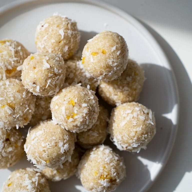 Delicious holiday snack lemon ginger balls ready to brighten your seasonal celebrations.