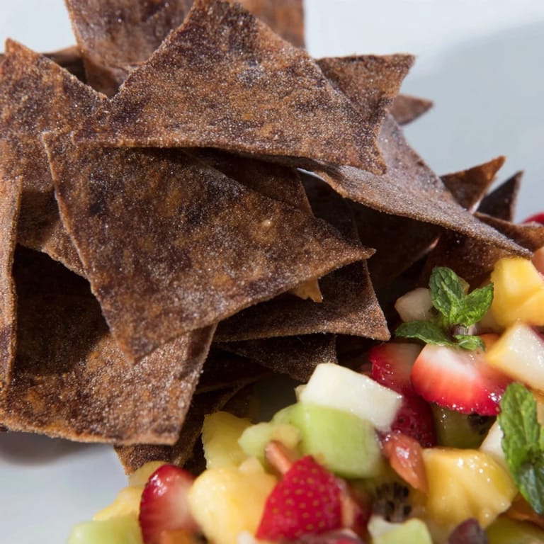 Delicious Dessert Chips & Salsa showcase a sweet twist with vibrant, fresh fruit toppings.  