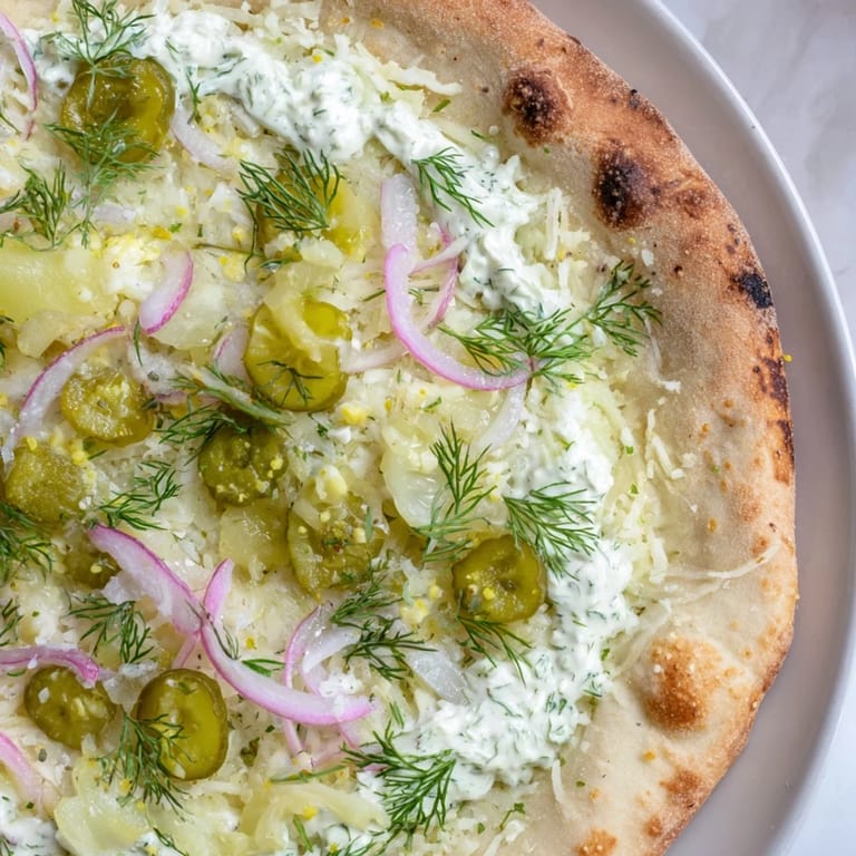 Deliciously unique pickle pizza topped with crunchy dill pickles and fresh dill.  