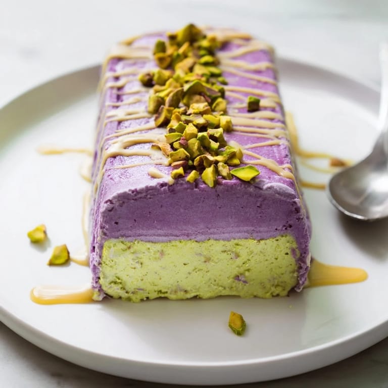Colorful layers of ube and pistachio ice cream bars, drizzled with sweet condensed milk.  