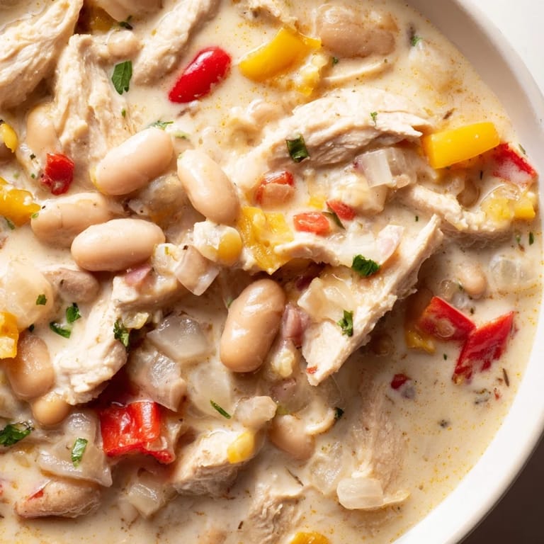 A close-up shot of rich and flavorful Creamy White Chicken Chili with Beans, perfect for a chilly evening meal.