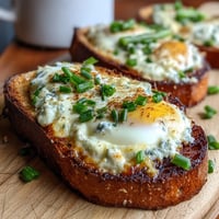 Asparagus and Egg Tartines: open-faced sandwiches with creamy scrambled eggs, tender asparagus, and fresh chives on rustic toast.